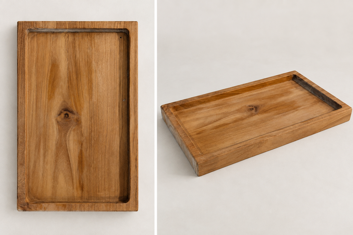 A rectangular wooden tray with a raised rim and recessed center, shown from two angles on a light neutral background. One view shows the top surface with visible wood grain and knot, and the other shows the tray at an angle with its depth and interior edge visible.